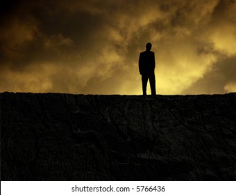 Man standing on a mountain at sundown, looking at bottomless hole