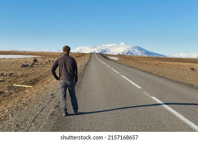 Man standing on the road heading toward the unknown.  Long time ago me and my brother Kyle here,
We was hitchhiking down a long and lonesome road
