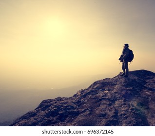 Young Man Standing On Rock While Stock Photo (Edit Now) 1833153901