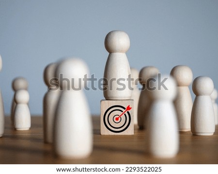man standing on target Wooden people standing on wooden blocks icon. success through effort competing with a large number of people achieve the set goal