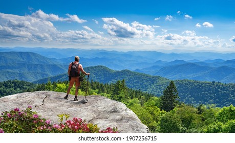 Man Standing On Top Of The Mountain Relaxing And  Enjoying Beautiful Summer Mountain Landscape. A Panoramic View Of The Smoky Mountains From The Blue Ridge Parkway In North Carolina. Near Asheville.