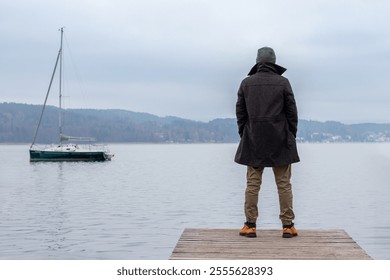 Man standing on wooden deck - Powered by Shutterstock