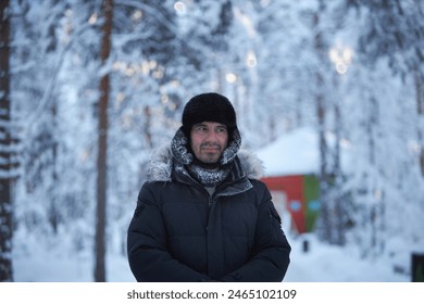 Man Standing in Snowy Forest - Powered by Shutterstock