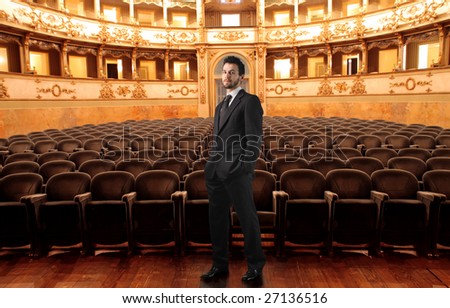 man standing in a theater