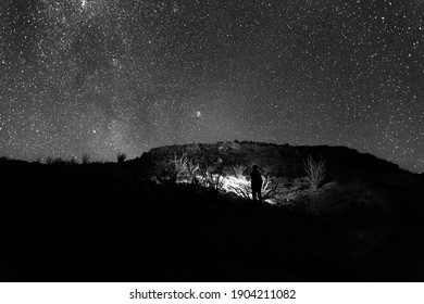 A Man Standing Under The Night Sky In Texas.