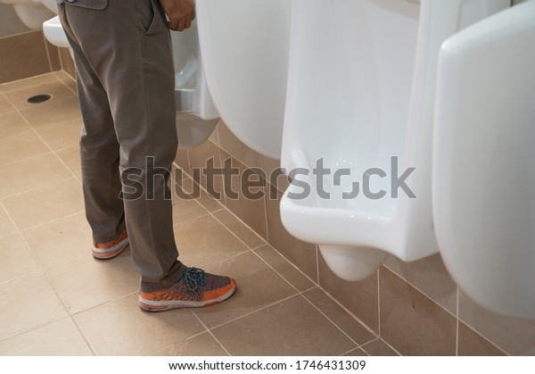 Man Standing Urinating Public Man Toiletwhite Stock Photo 1746431309 ...