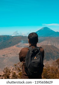 Man standing while looking at mountain
