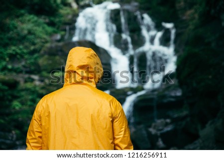 Similar – Foto Bild Mann in gelbem Regenmantel Wandern im Freien