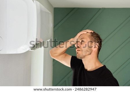 Image, Stock Photo Man Escaping Heat Under Air Conditioner