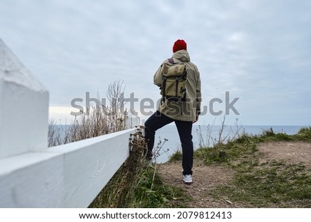 Similar – Image, Stock Photo Enjoy the view. Woman with headband, jacket. Ireland