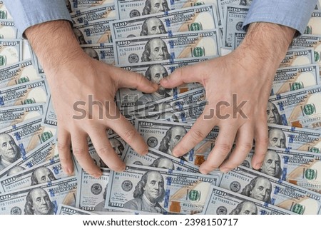Man steals money, man in business clothes with dollars, Cash in hands. Profits, savings. Stack dollars. Success, motivation, financial flows, wealth. Stack of dollars,dollars in hand. money background
