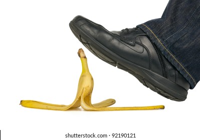 Man Stepping On Banana Peel Isolated On White