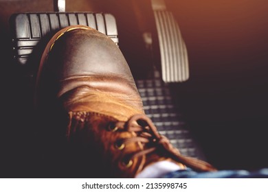 man stepping on car brake To slow down, stop the car both normal and abruptly, transfer the weight to press the front wheels to grip the road and turn more stable - Shutterstock ID 2135998745