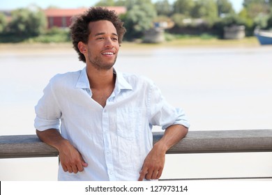 Man stood by riverfront
