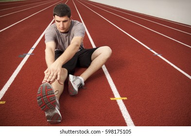 A Man Stretching Before Working Out.