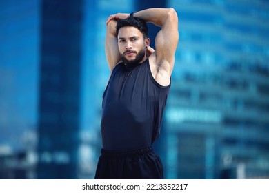 Man Stretching For Fitness Training In City, Running For Cardio Exercise And Workout For Strong Body Motivation. Commitment, Healthy And Sports Runner Or Athlete Ready For Sport Competition In Dubai