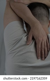 A Man Stretching His Triceps Muscles. This Type Of Stretch Could Also Be Considered A Shoulder Stretch.