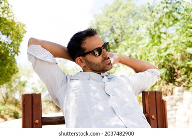 Man Stretching Neck In The Park