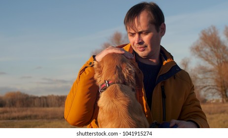 Man Is Stroking Dog. Slow Motion.