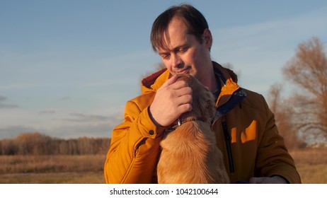 Man Is Stroking Dog. Slow Motion.