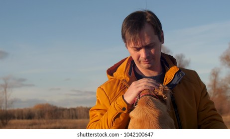 Man Is Stroking Dog. Slow Motion.