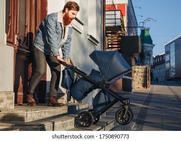 Man With A Stroller. Father Walking With A Stroller And A Baby.