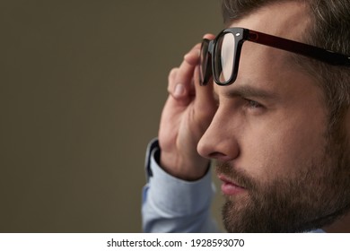 Man Struggling To See Something Without Spectacles