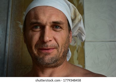 Man With Stubble And Dusty Face Looks Into The Lens