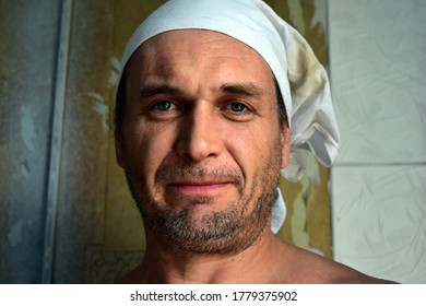 Man With Stubble And Dusty Face Looks Into The Lens