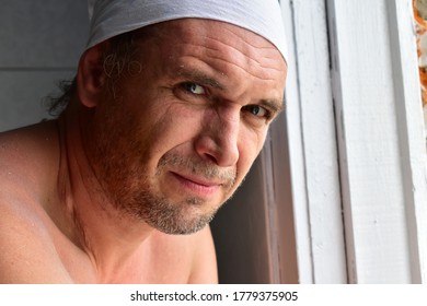 Man With Stubble And Dusty Face Looks Into The Lens