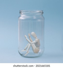 A Man Stuck In A Glass Jar Representing Mental Health.