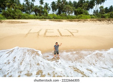 Man stuck on uninhabited island, inscription HELP on sand. Lonely survivor standing in water on deserted tropical beach calls for help. Concept of lost stranded people, castaway, sea island and sos.