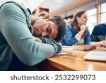 Man, student and sleep at college with group, burnout and tired with books, tech and education in library. Person, fatigue and exhausted with studying, learning and development in hall at university