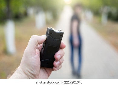 A Man With A Stun Gun Chases A Woman Rob.