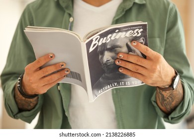 Man With Stylish Manicure Reading Business Magazine, Closeup