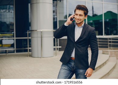 Man In A Stylish Suit. Businessman In A Summer City. Male Use The Phone