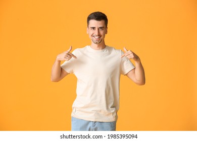 Man in stylish t-shirt on color background - Powered by Shutterstock