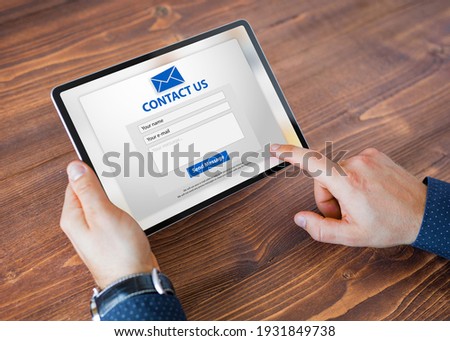 Man submitting contact form on website