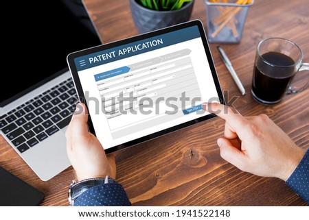 Man submitting patent application online