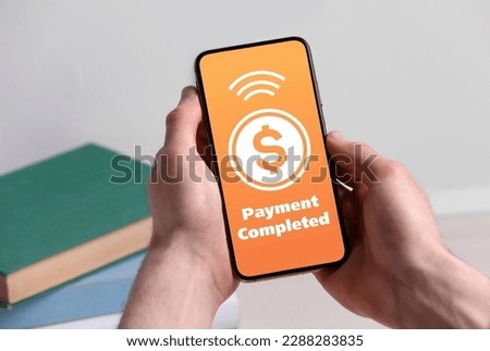Man successfully made payment using online banking application on smartphone indoors, closeup