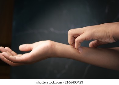 Man Suffering From Itching Skin On Black Background 