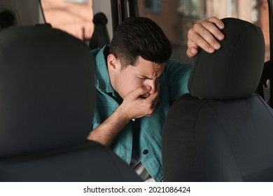 Man Suffering From Nausea In His Car