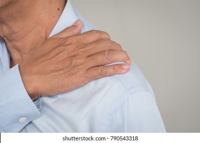 man suffering from neck, shoulder pain