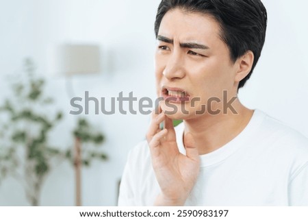 Man suffering from teeth and skin problems