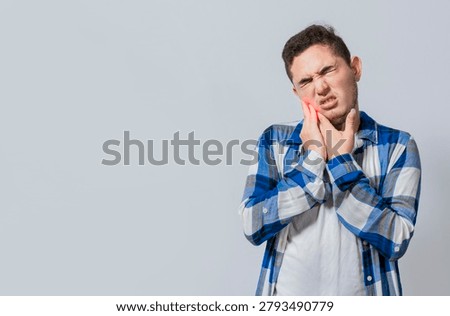 Man suffering with toothache or pulpitis isolated. Young man with sensitivity and toothache isolated. Tooth pain and sensitivity in people