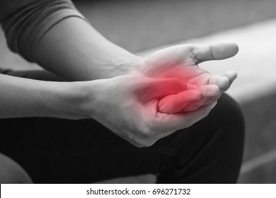 man suffering from trigger finger, arthritis, wrist pain