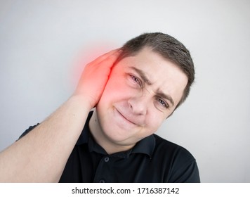 A man suffers from pain in the ear. The auditory meatus hurts due to otitis media, cerumen plug, ear boil, or trigeminal neuralgia
