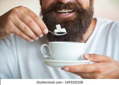 Man And Sugar. Calories. Sugar Free. Coffee Sweetener. Dental Health And Overweight. Bearded Man Drinking Tea. Diet.