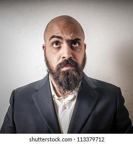 man with a suit and beard and strange expressions on white background