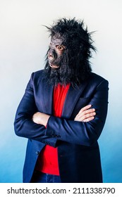 Man In A Suit And With A Gorilla Mask.